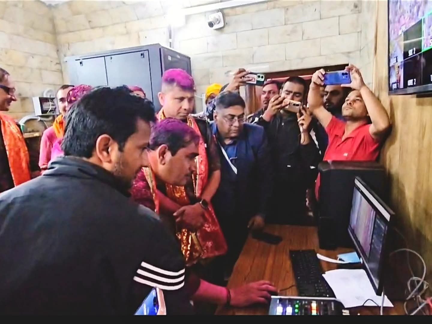 "Banke Bihari Mandir Holi Festival in Vrindavan with devotees playing colors and performing traditional dances, live streaming initiated"