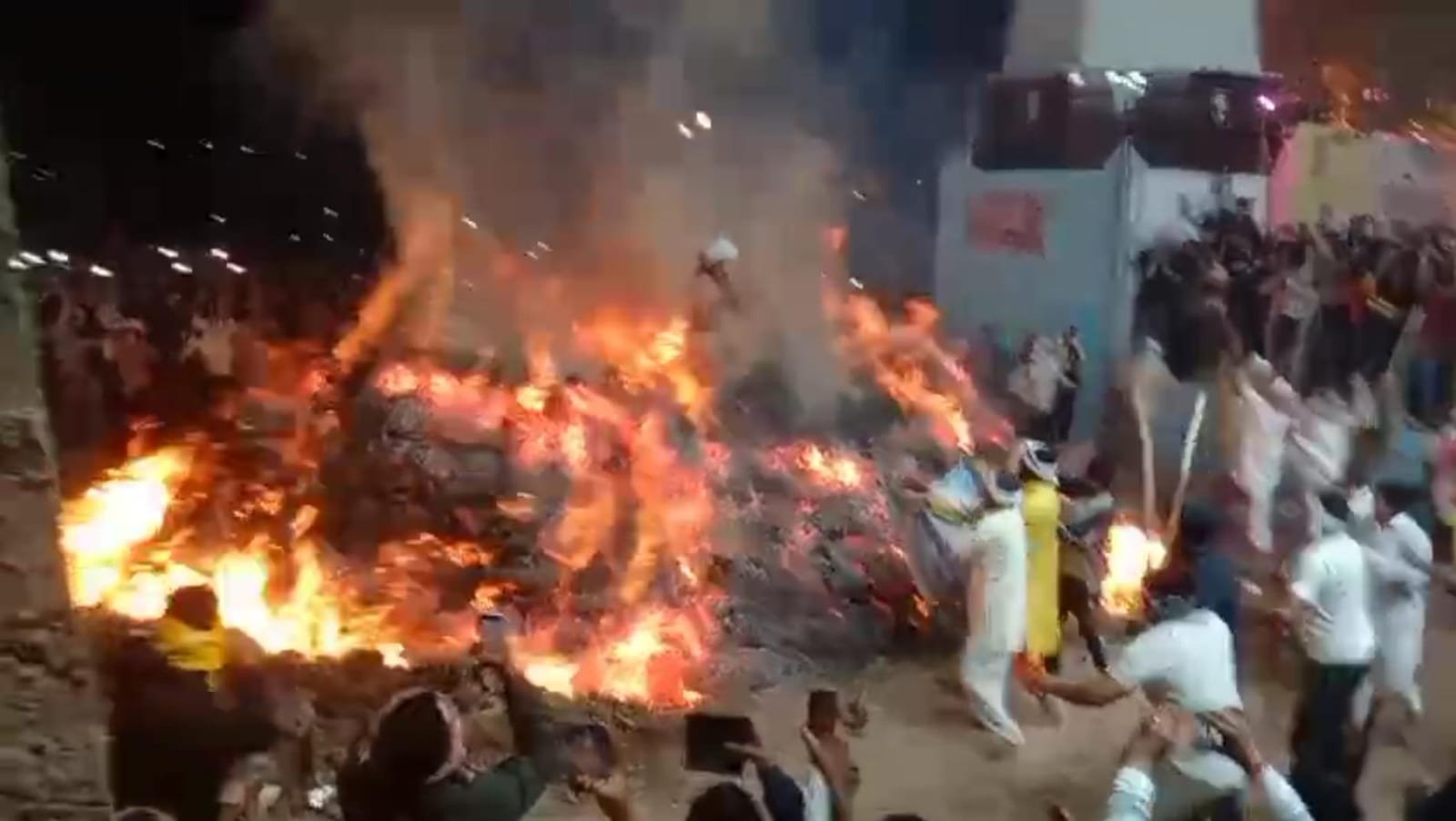 Sanju Panda performing the unique Holika Dahan ritual at Prahlad Mandir, Mathura with devotees celebrating
