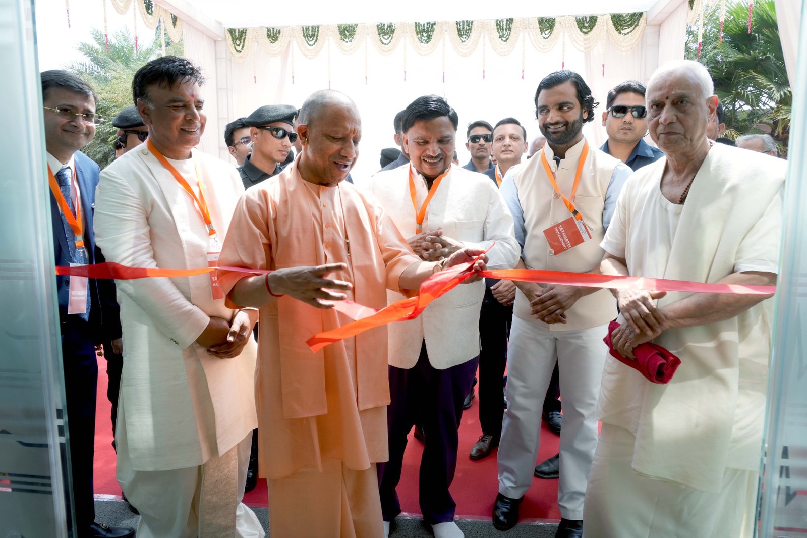 Uttar Pradesh Chief Minister Yogi Adityanath visiting Agra for an official political event, interacting with local leaders and the public.