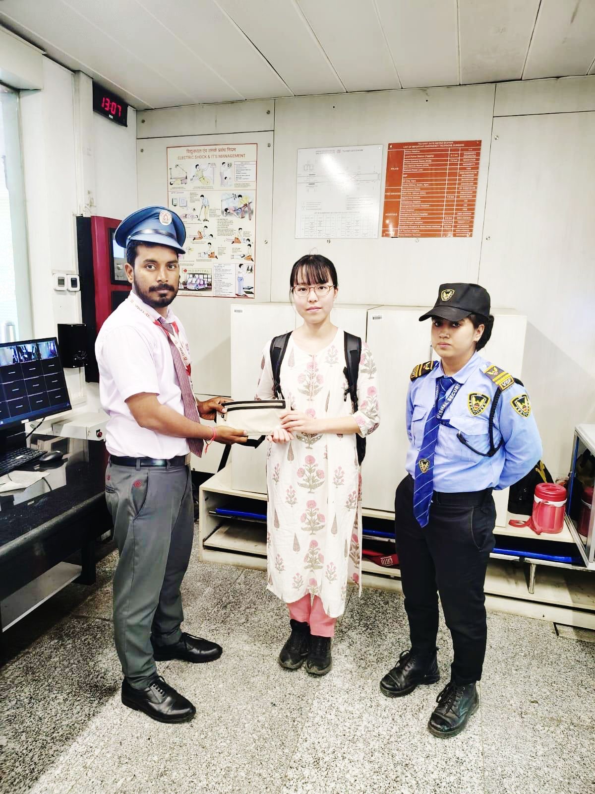 Agra Metro staff returning lost wallet and passport to Japanese passenger Rumina Suzuki at Taj East Gate Metro Station