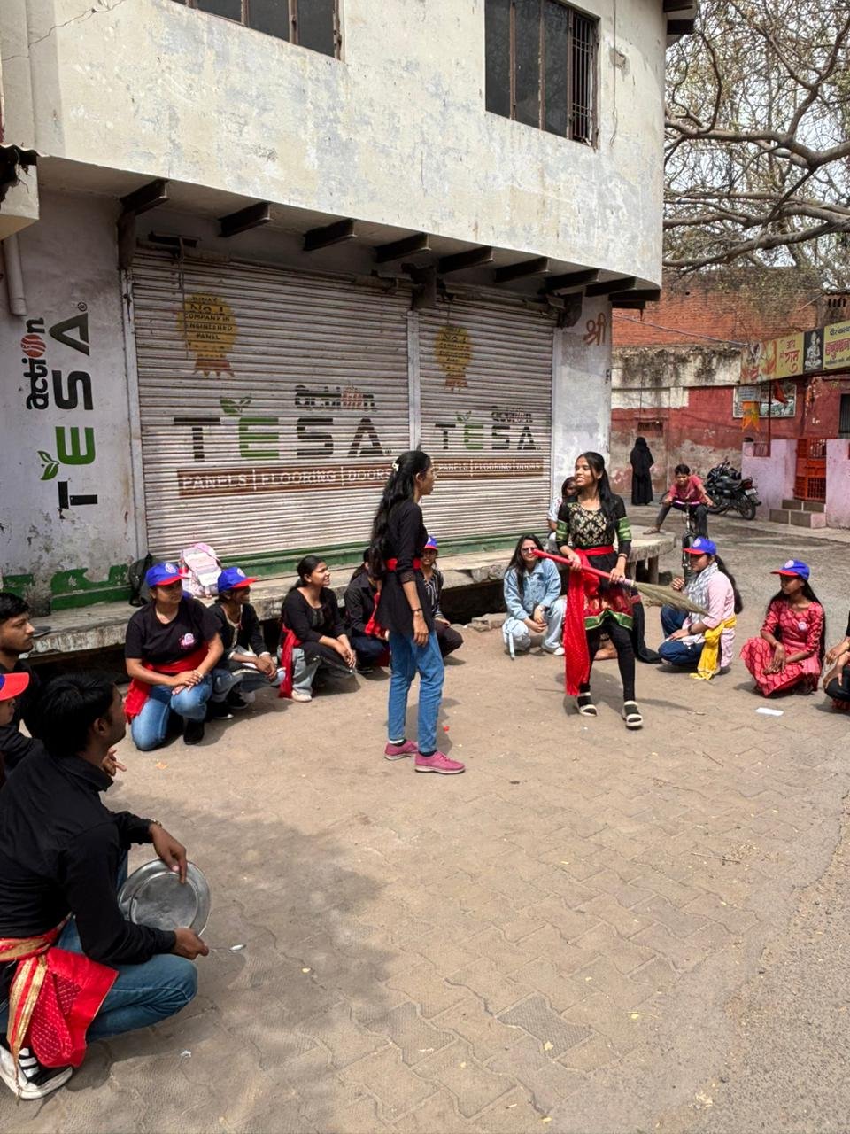 Participants performing street plays on voting awareness, dowry prohibition, cleanliness, and drug de-addiction during the 5th day of the NSS seven-day special camp at Dr. Bhimrao Ambedkar University Agra