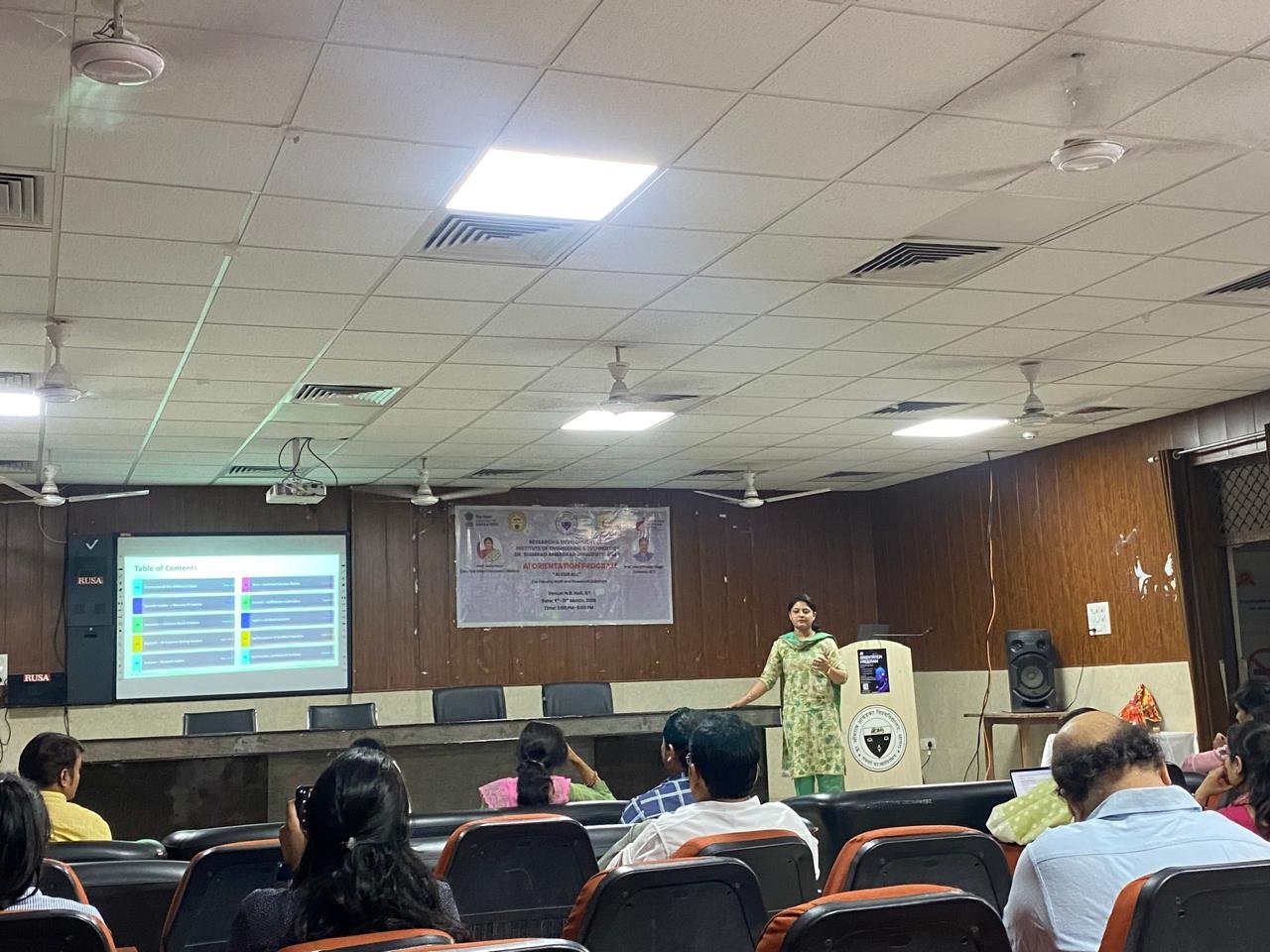 Teachers, staff, and researchers attending AI for All orientation program at Dr. B.R. Ambedkar University Agra learning practical applications of AI tools like Overleaf, SciSpace, Elicit, Semantic Scholar, Paperpal, Napkin AI, and Consensus