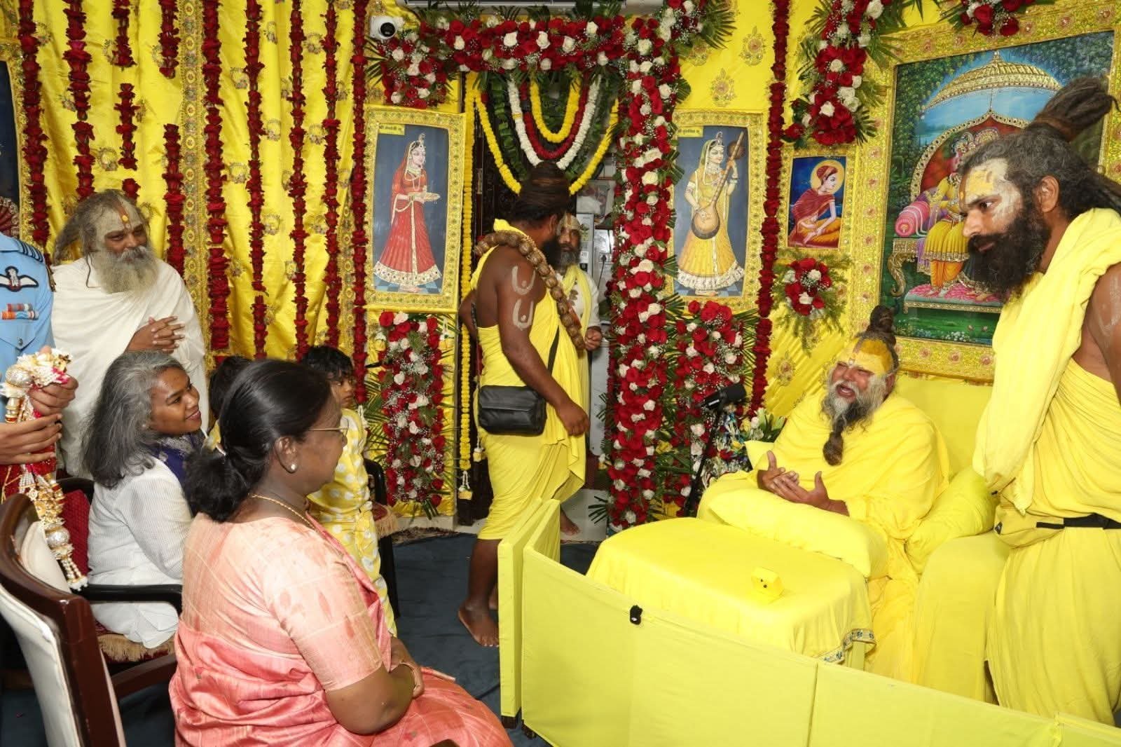 The President meeting Premanand Maharaj and visiting Neeb Karori Baba Temple during a religious visit, engaging in a spiritual interaction and temple darshan