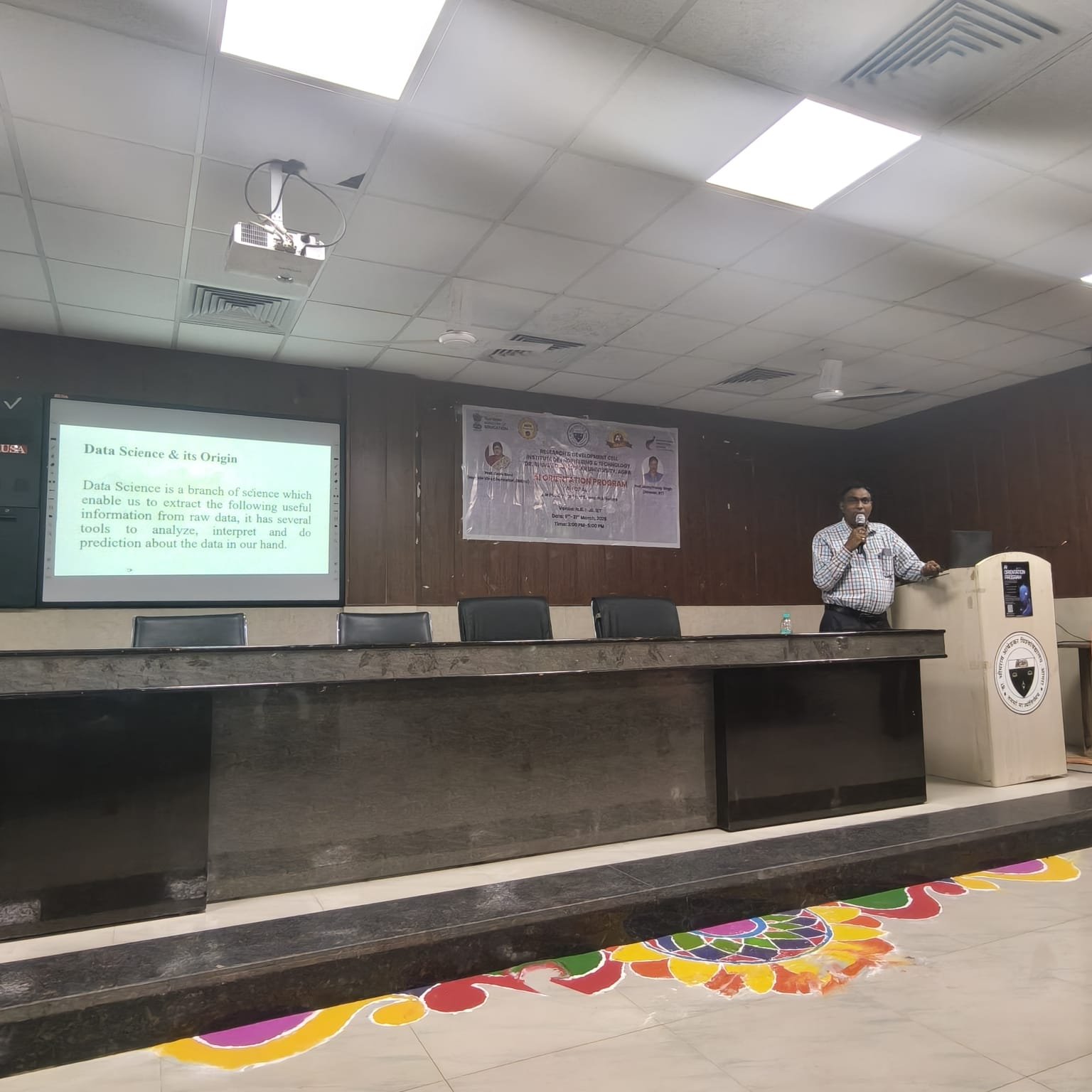Experts delivering a lecture on Generative AI and Data Science during the AI for All program at Dr. Bhimrao Ambedkar University Agra IET campus with teachers and researchers attending