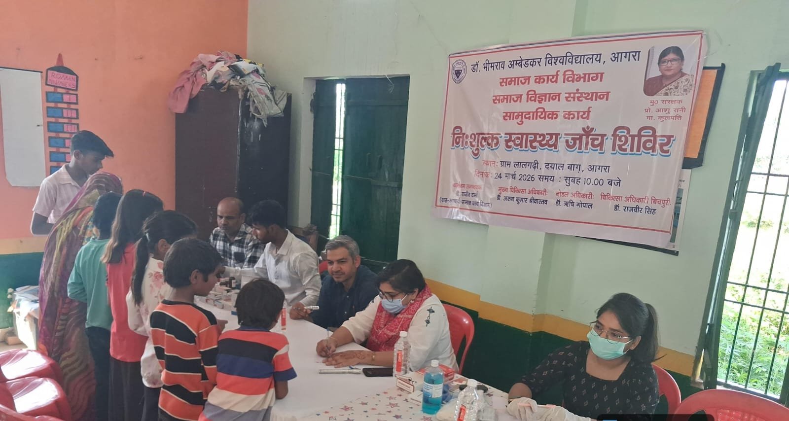 Students of Dr. Bhimrao Ambedkar University conducting a free health camp in Gram Lalgadhi and a traffic awareness program at a school in Gram Sunhari, Agra