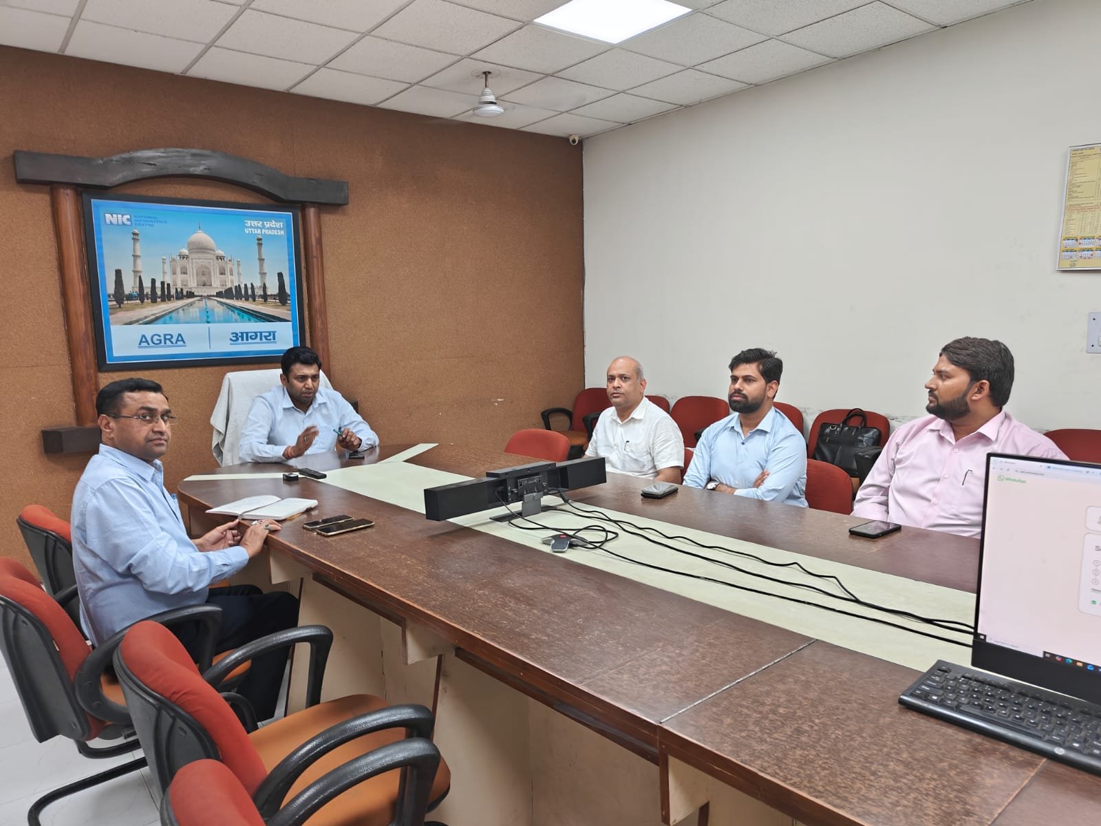 District Magistrate Agra chairing a meeting with oil company officials regarding commercial gas cylinder supply issues and new allocation guidelines