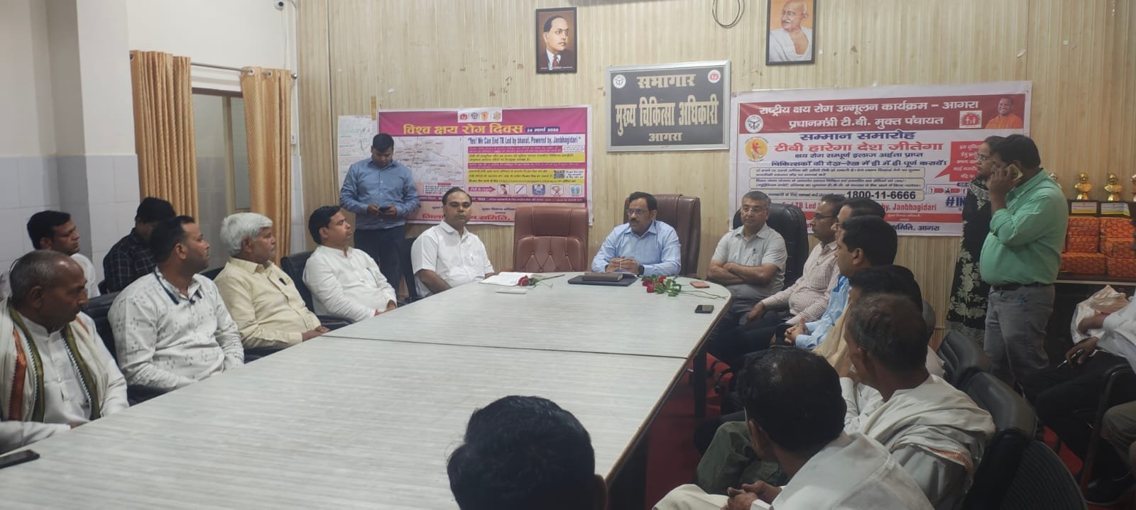 Officials honoring gram pradhans during TB free gram panchayat award ceremony in Agra on World Tuberculosis Day