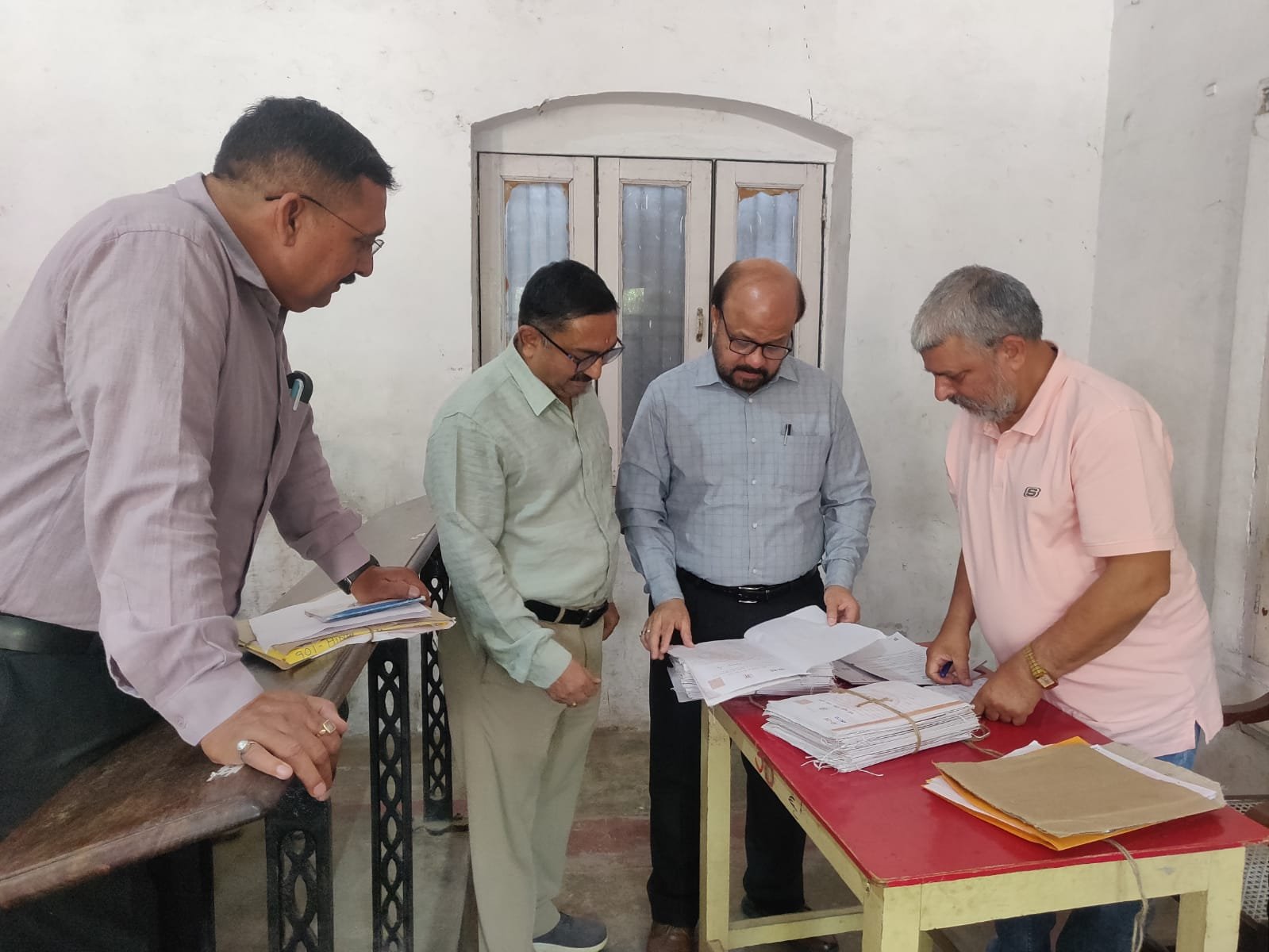 Joint Education Director inspecting evaluation center during UP Board answer sheet evaluation in Agra