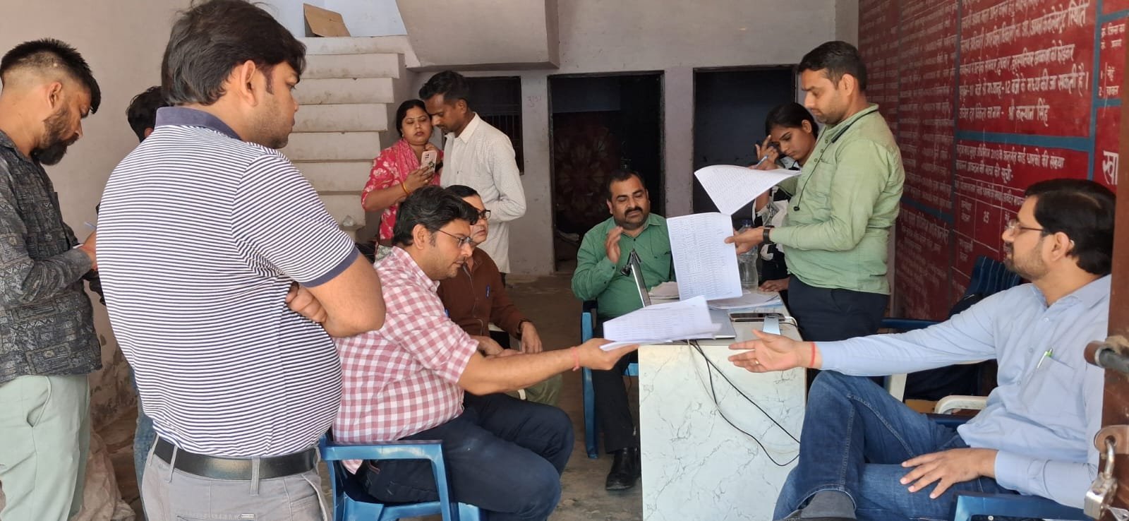 Officials conducting door-to-door survey for Ayushman Bharat scheme in Kundol village Agra to help residents get health insurance cards