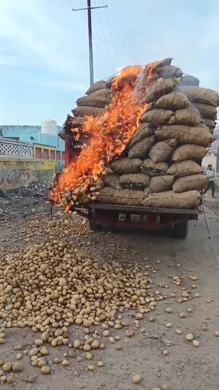 Tractor trolley loaded with potatoes caught fire after hitting electrical cable in Fatehabad Agra causing damage and injury to a bike rider