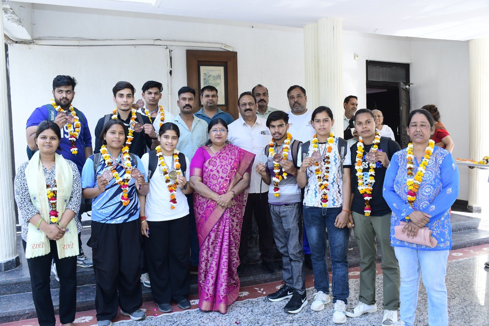 Dr Bhimrao Ambedkar University Agra players celebrating after winning 11 medals in All India Inter University Arm Wrestling competition