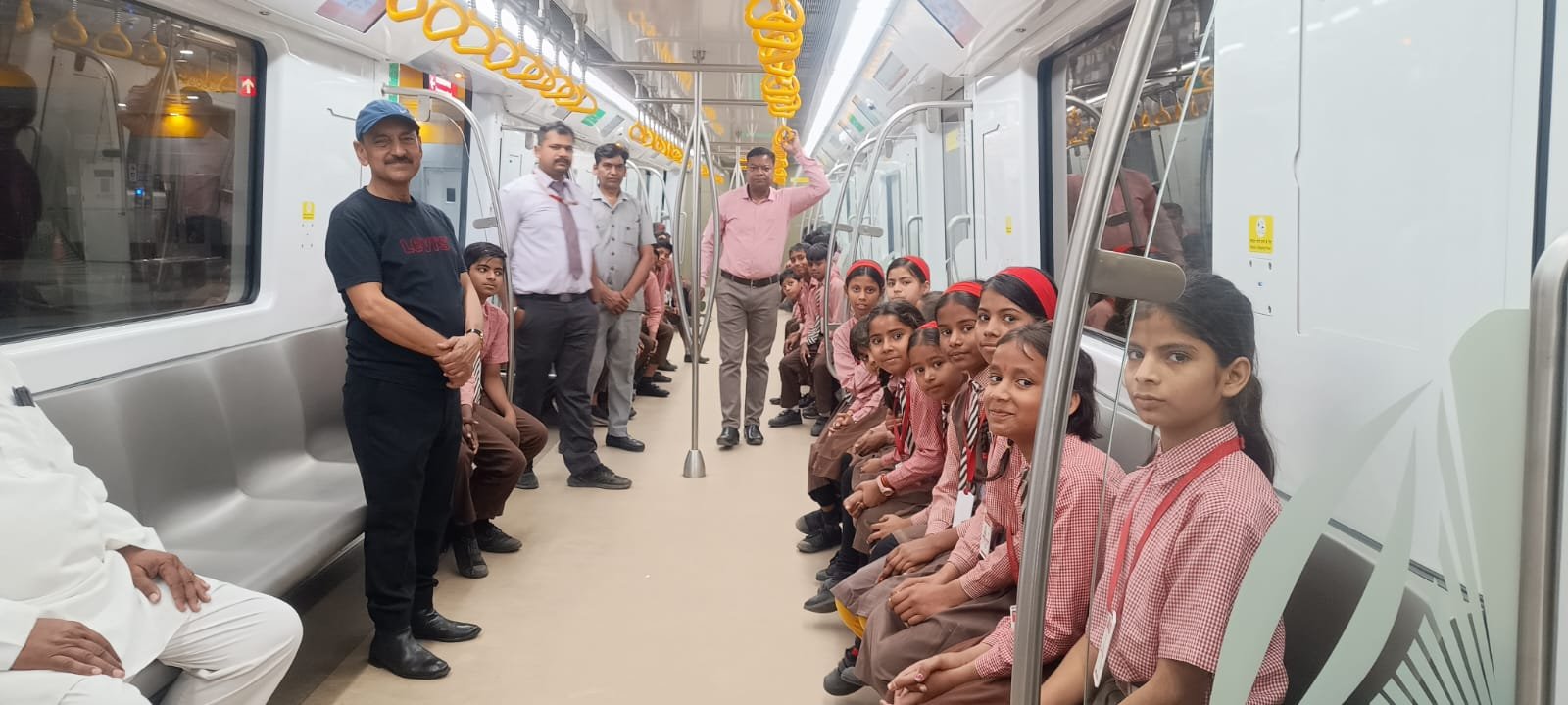 Chhipitola primary school students enjoying Agra Metro ride with teachers during an educational visit