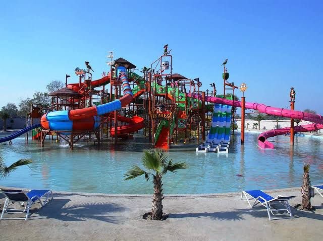 Agra Metro passenger using Go Smart Card enjoying Vembo Water Park, summer fun, water slides, and amusement park experience.