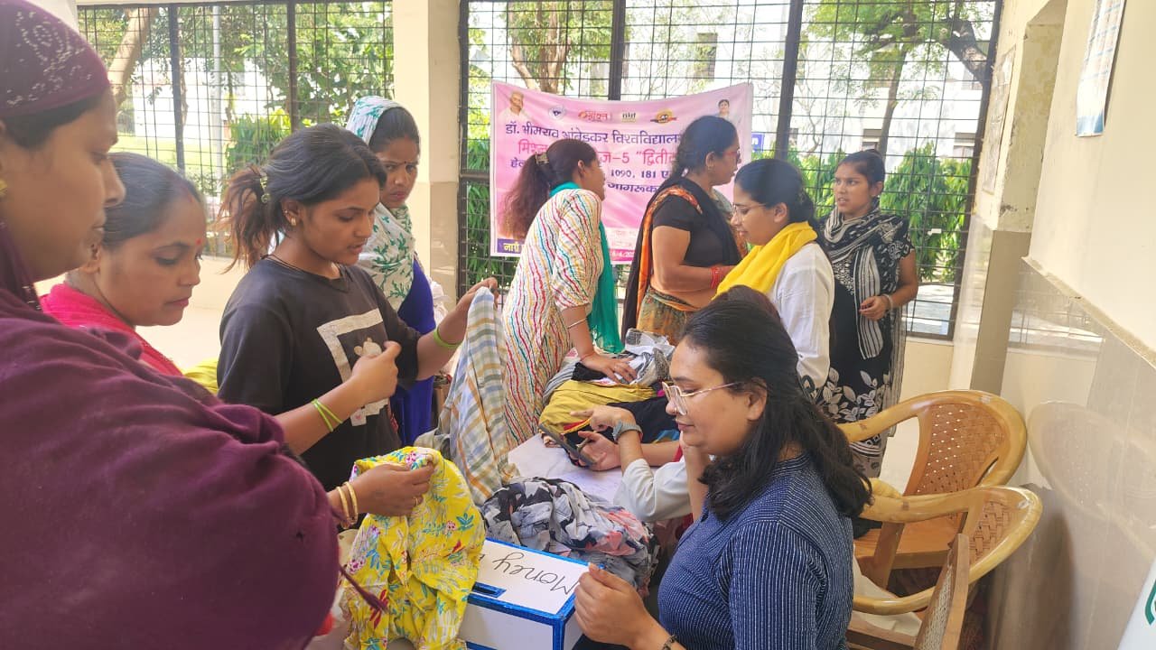 Needy families receiving affordable clothes and household items at Bapu Bazaar organized by Dr. Bhimrao Ambedkar University, Agra
