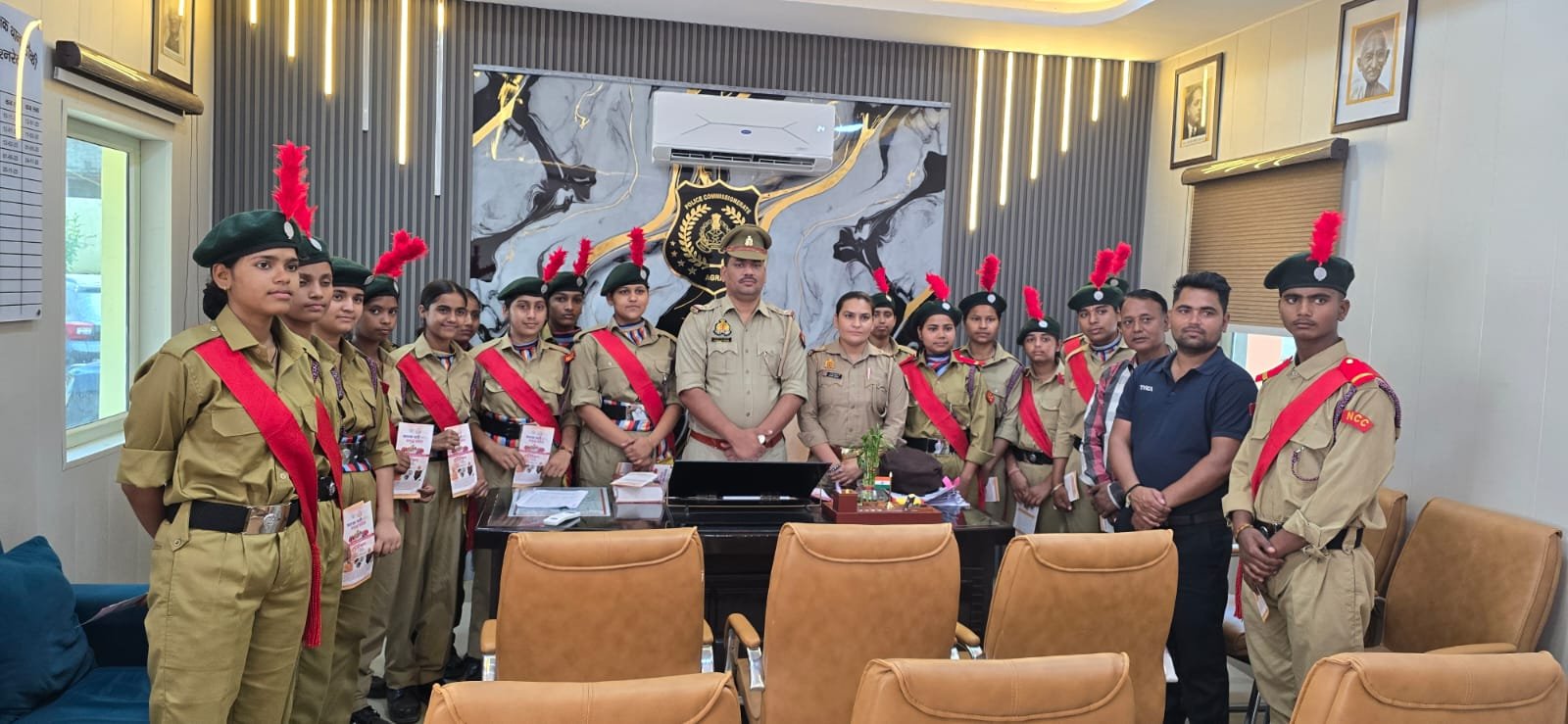 NCC cadets learning about government schemes and safety measures during visit to Dauki Police Station in Fatehabad