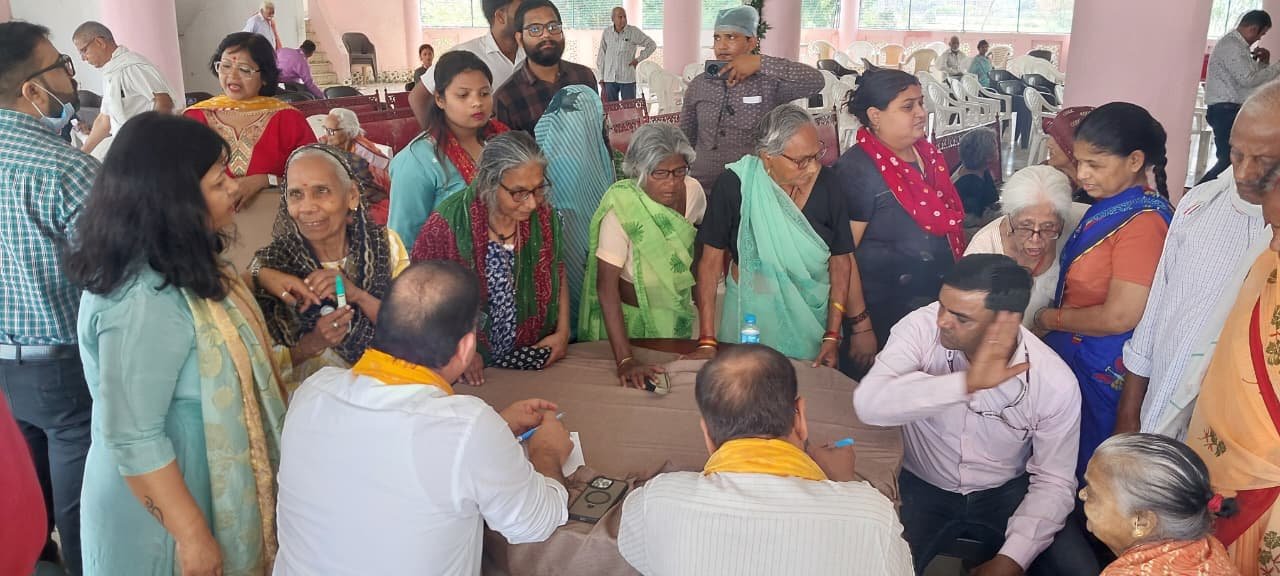 Medical team providing free health check-up, medicines, and eyeglasses to elderly residents at Ramlal Old Age Home