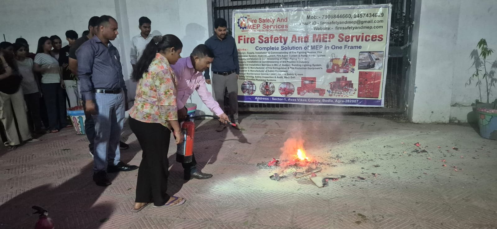 Female students actively participating in fire safety and disaster management workshop at Dr. Bhimrao Ambedkar University, Agra