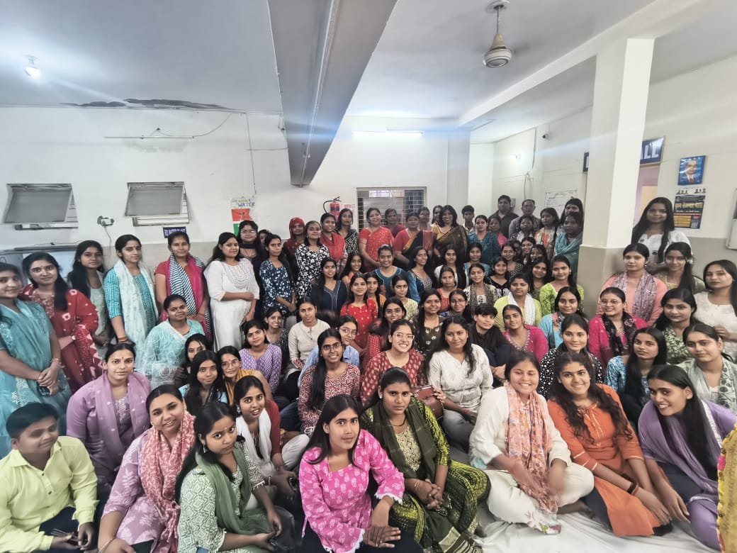 Female students performing devotional bhajans during spiritual event at Dr. Bhimrao Ambedkar University Agra