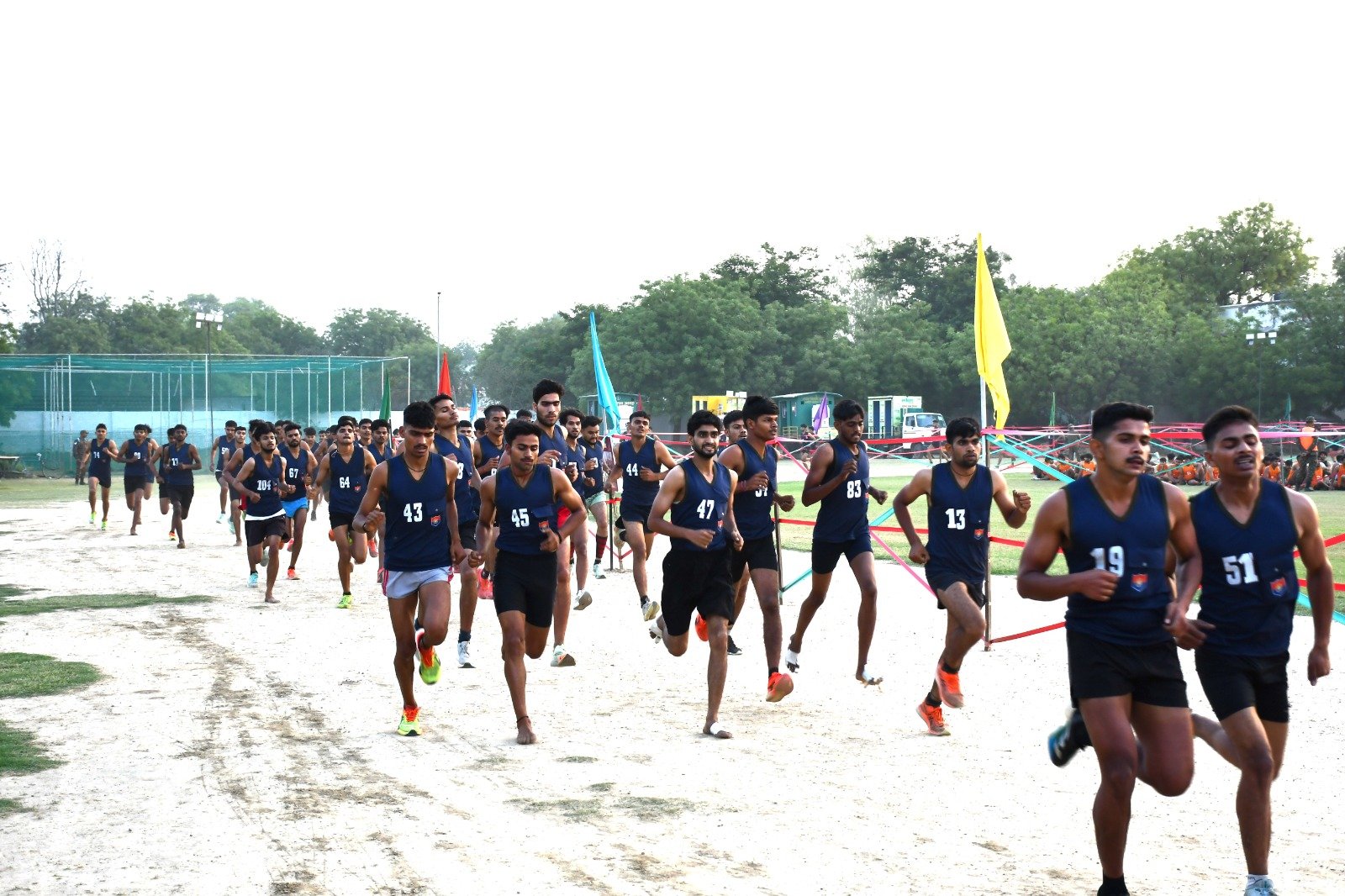 Young candidates running during Agniveer Army recruitment rally physical fitness test in Agra stadium