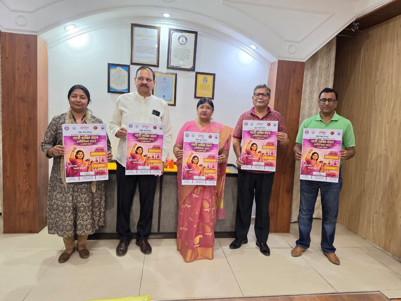 University officials releasing poster on Nari Shakti Vandan Adhiniyam 2023 at Dr. Bhimrao Ambedkar University Agra