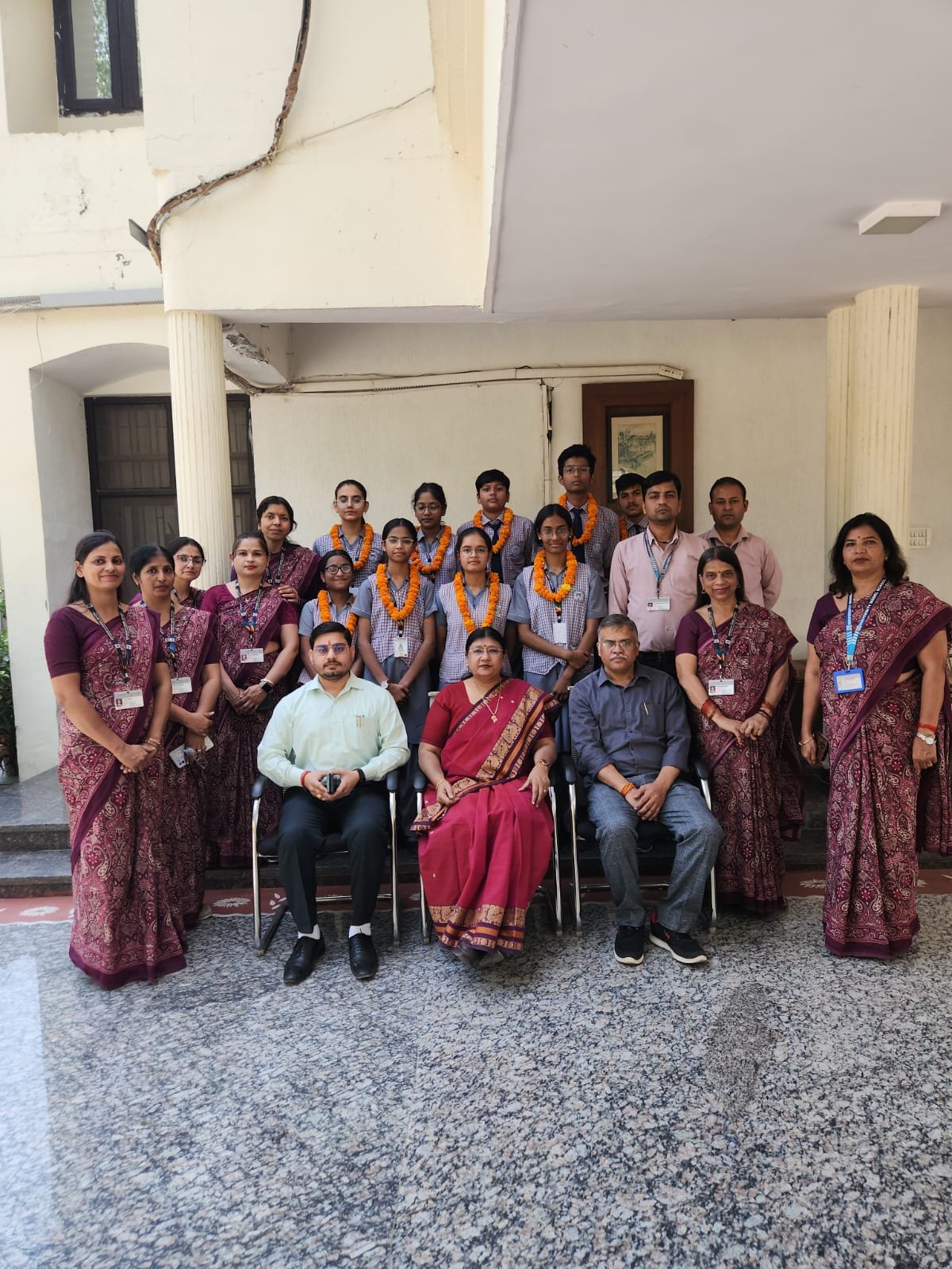 Students and teachers celebrating 100 percent CBSE Class 10 result achievement at University Model School Swami Vivekananda Campus Agra