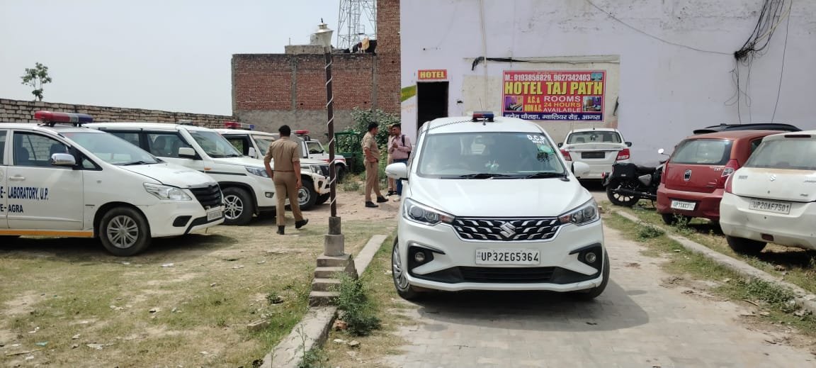 Police investigating crime scene after girlfriend killed boyfriend with hammer inside hotel room in Itaura area of Agra