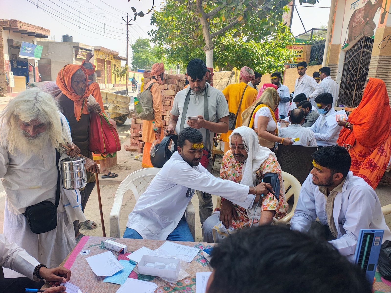 Pharmacy students of Dr. Bhimrao Ambedkar University conducting free health checkup of 400 saints and elderly people at Mor Kuti Ashram Vrindavan during Akshaya Tritiya health camp