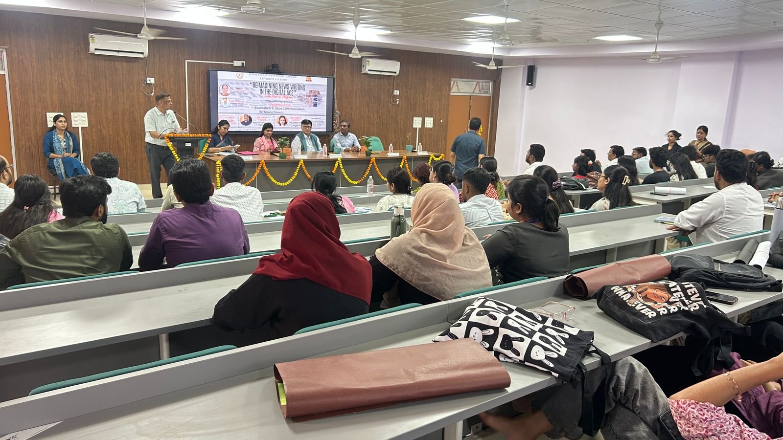 Expert Puja Saxena delivering lecture on digital journalism and AI in national workshop at DBRAU Agra and Lucknow university event