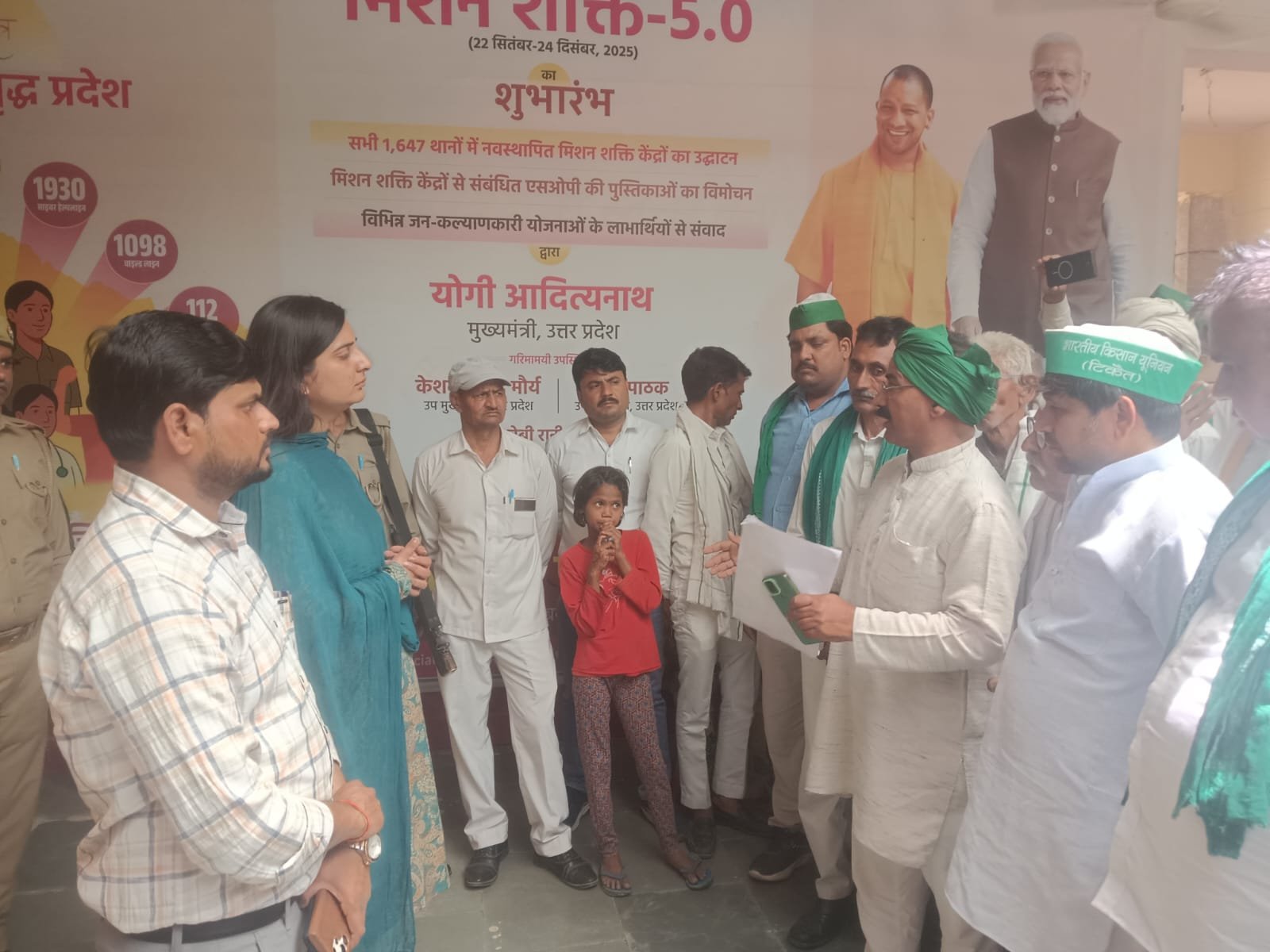 A group of villagers and farmers in Fatehabad submitting a memorandum to the Sub-Divisional Magistrate regarding alleged illegal encroachment and soil mining on land reserved for a mini stadium in Mevali Kala village. The villagers are seen gathered in a serious mood demanding strict action and protection of government land.