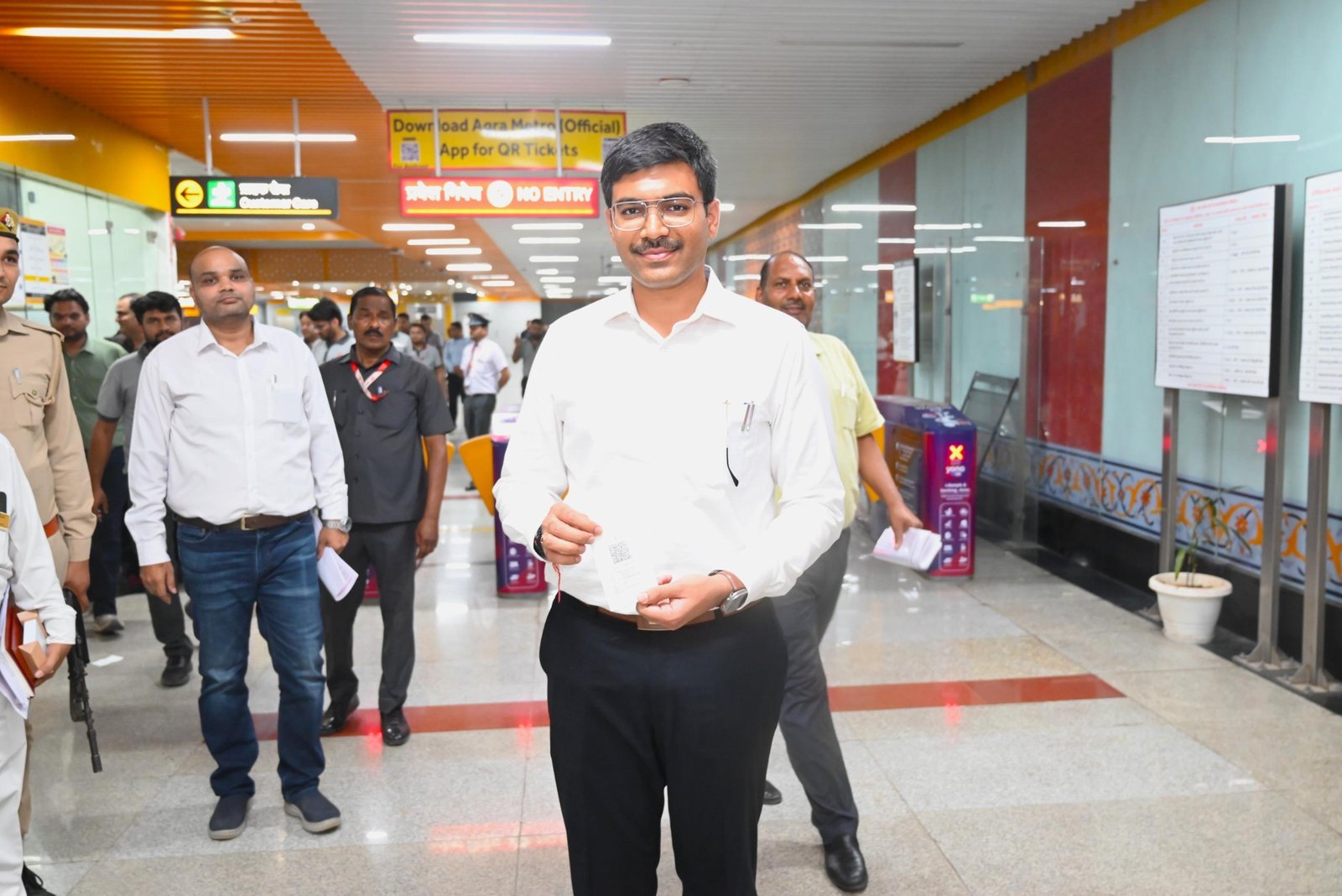 District Magistrate Agra Manish Bansal traveling on Agra Metro from Taj East Gate Station to Manikameshwar Station during inspection of metro facilities and infrastructure development with senior officials.