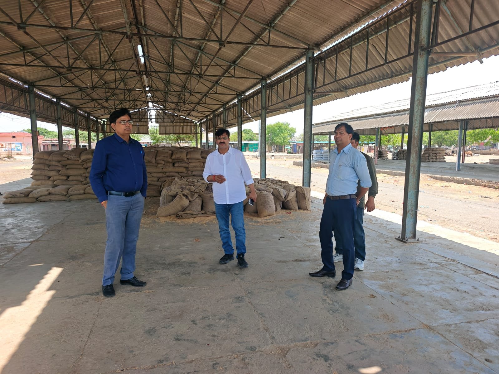 Officials inspecting a wheat procurement center in Agra during holiday operations ensuring smooth wheat purchase from farmers