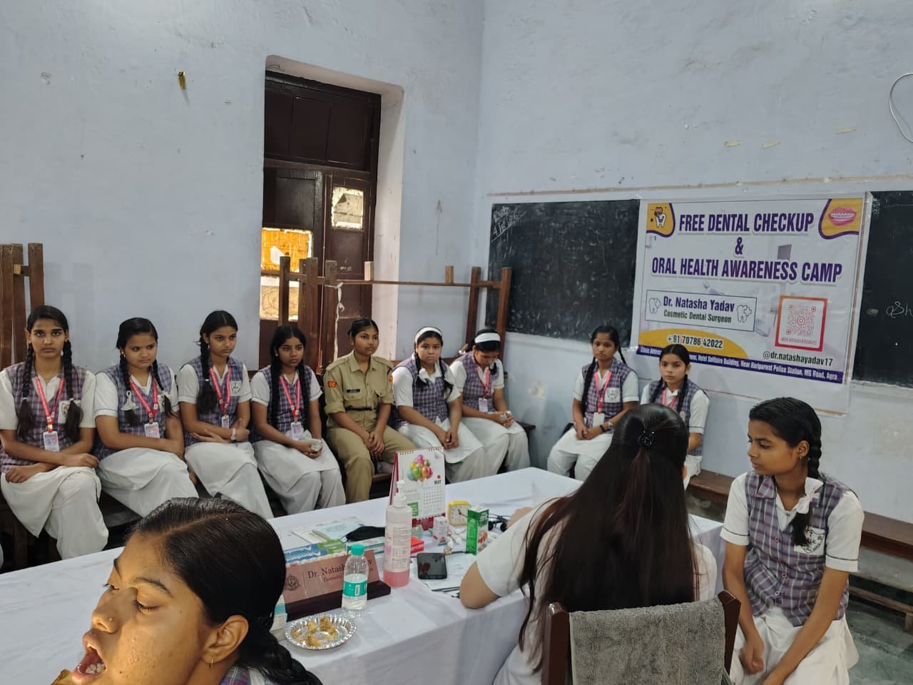 Doctors conducting dental check-up of students during health awareness camp at Queen Victoria Girls College Agra