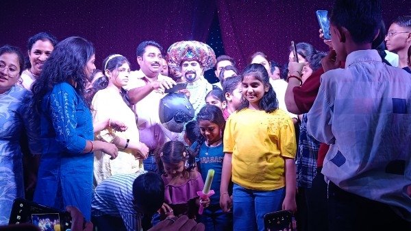 OP Sharma Junior performing an illusion act during a live magic show at Sur Sadan Auditorium in Agra with audience watching