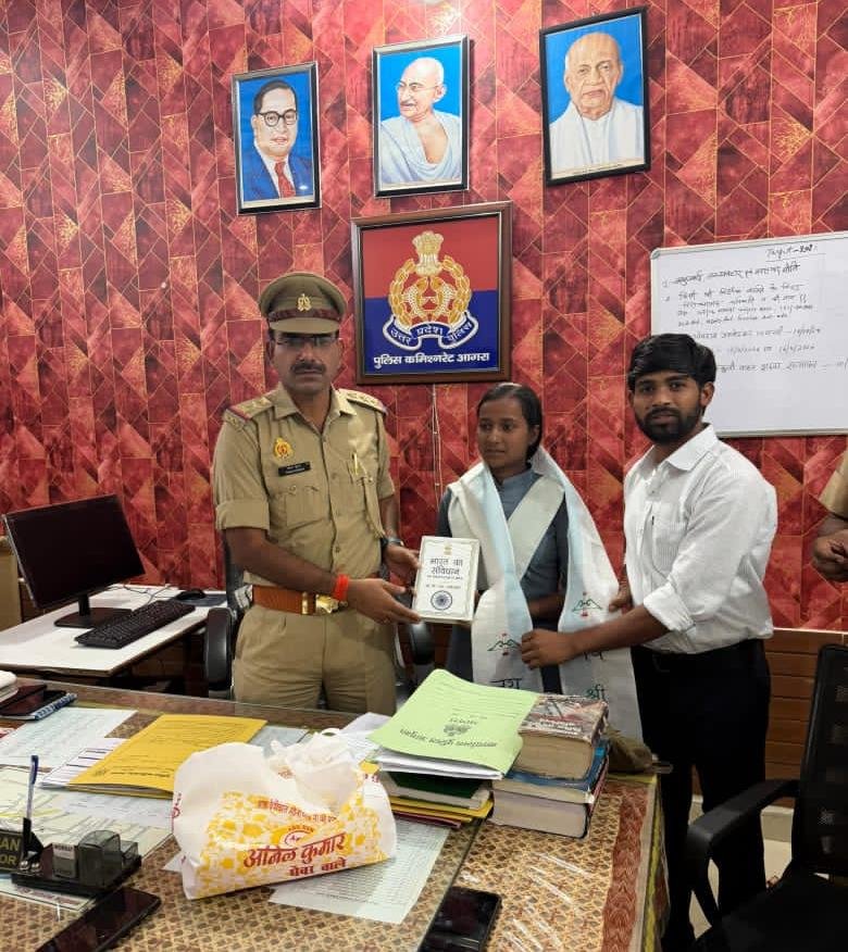 UP Board High School 2026 Agra district topper Vindesh Nishad being honored by Fatehabad Station Incharge Tarun Dhiman at Fatehabad police station in Agra