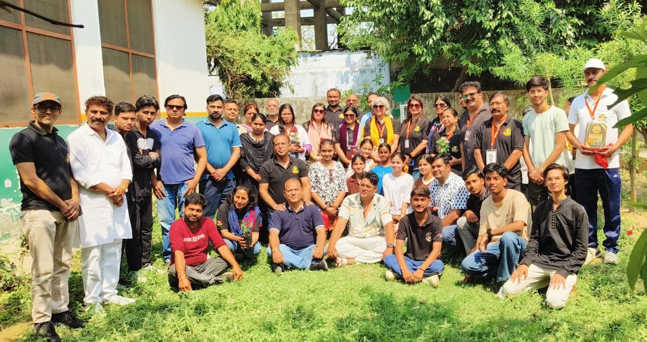 Students and volunteers during Mothers Day painting awareness campaign promoting education cleanliness and environment in school by YUWA and India Rising
