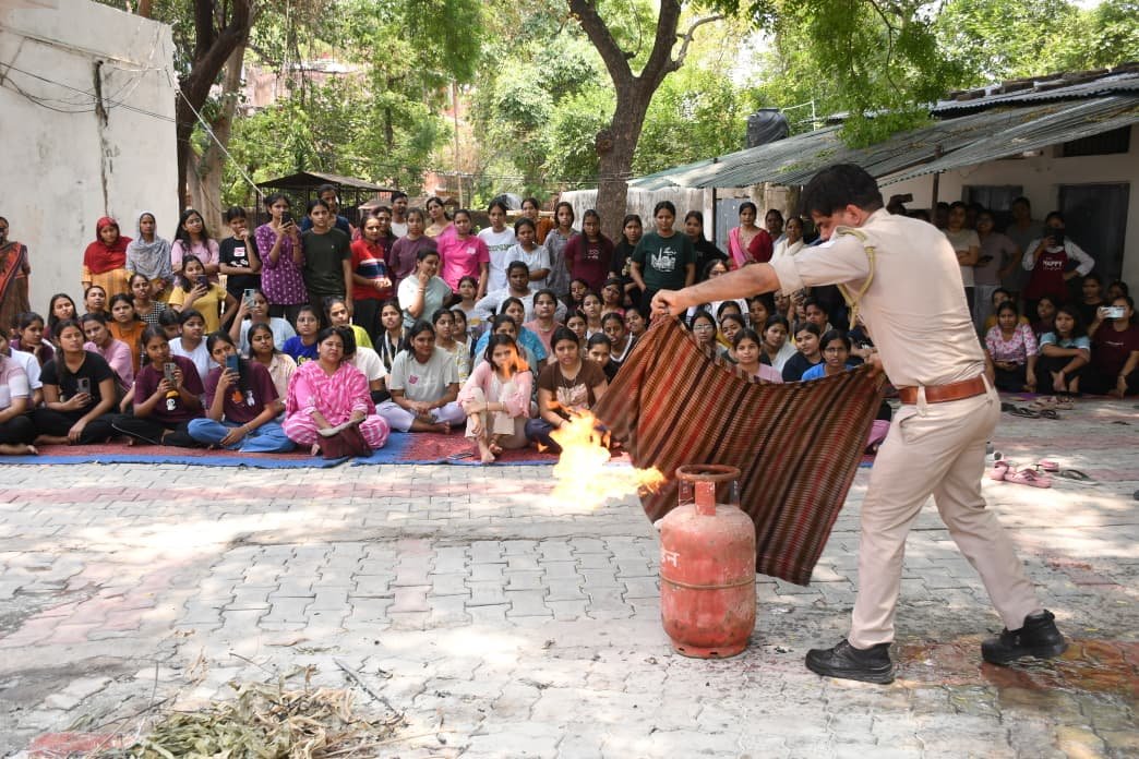 Girls students receiving fire safety and emergency response training during Mission Shakti program at Dr. Bhimrao Ambedkar University Agra