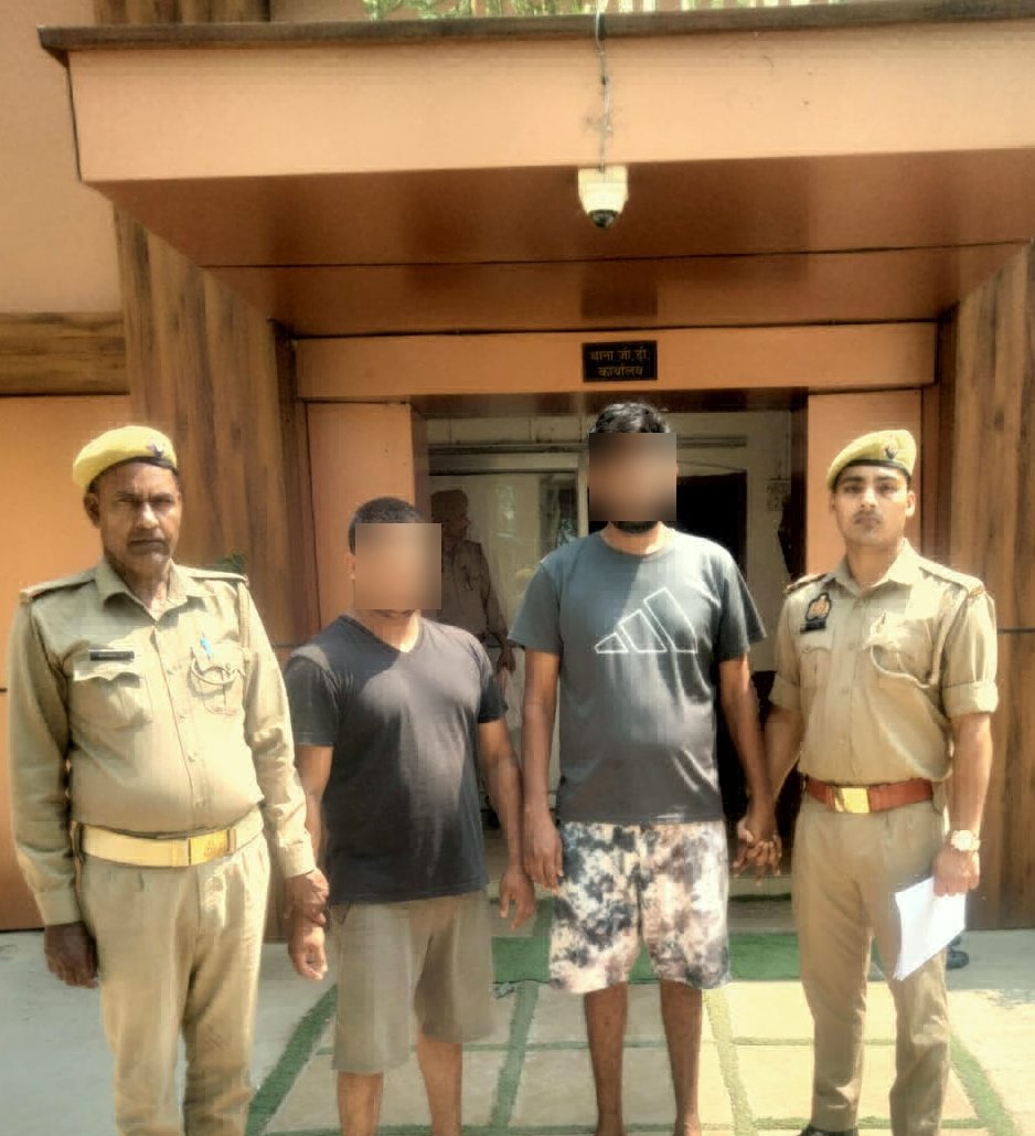 Police arresting two accused in IPL online betting racket with seized cash and mobile phones in Dauki Agra