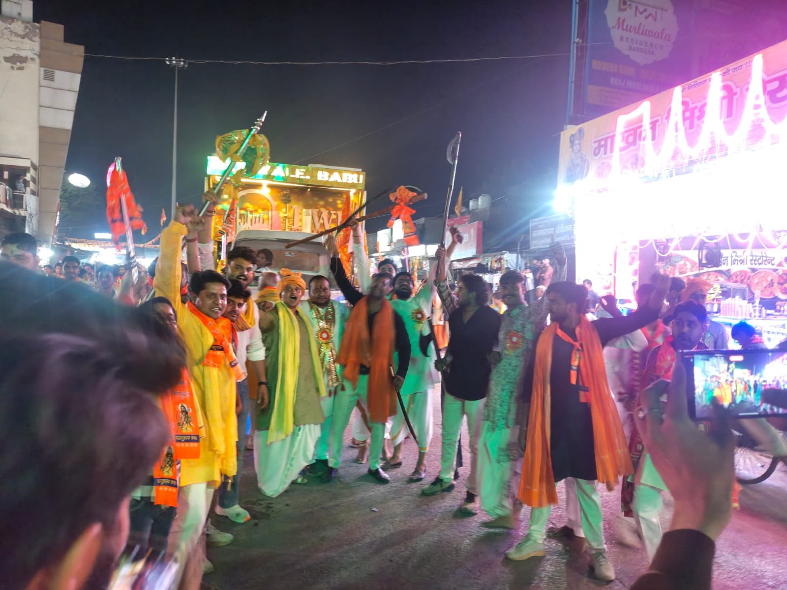 Devotees participating in the grand Lord Parshuram Shobha Yatra featuring colorful religious tableaux, flower showers, and cultural performances.