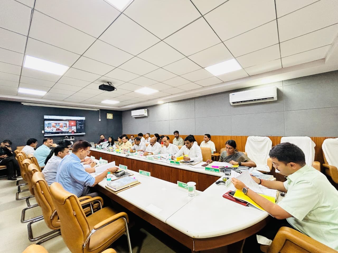 Officials attending the 152nd Agra Development Authority board meeting discussing city development projects and infrastructure plans.