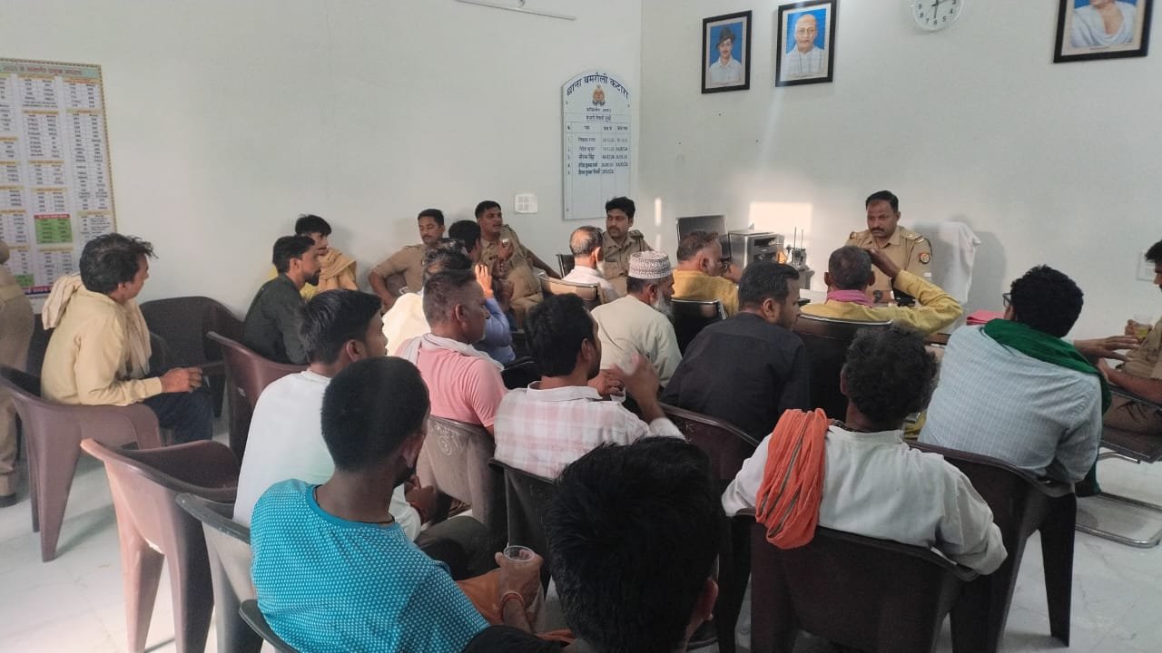 Police officials and local residents attending a peace committee meeting before Bakrid in Fatehabad and Bamrauli Katara