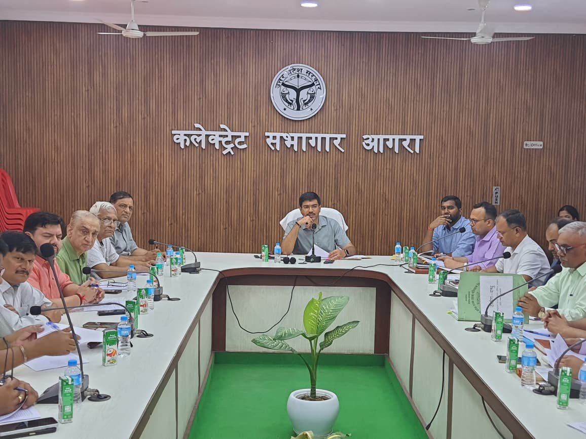 District officials and industry representatives attend the District Industry Committee meeting in Agra to discuss industrial development and Zardozi promotion.