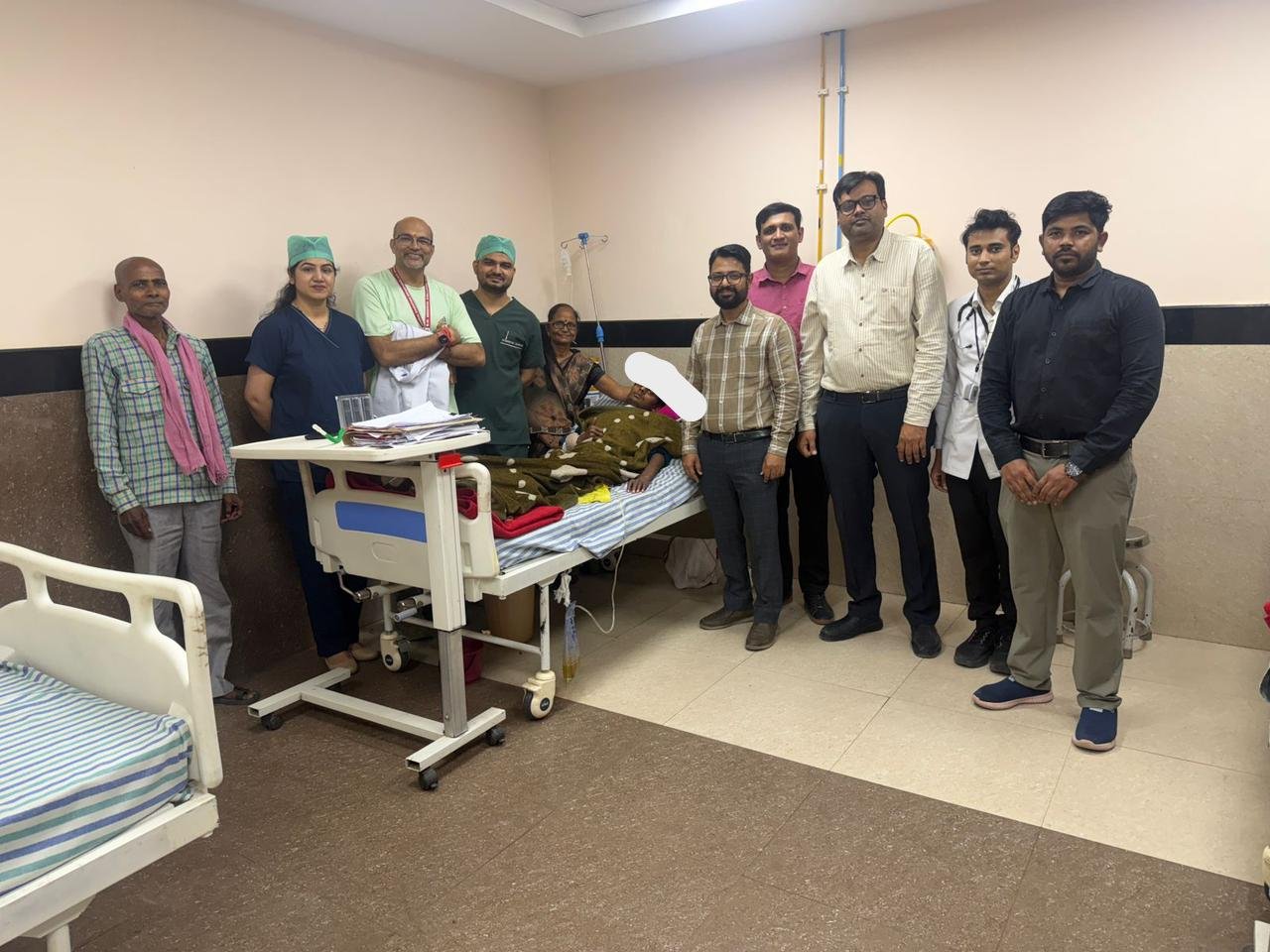 Doctors and ICU team at SN Medical College with a recovered road accident patient in Agra