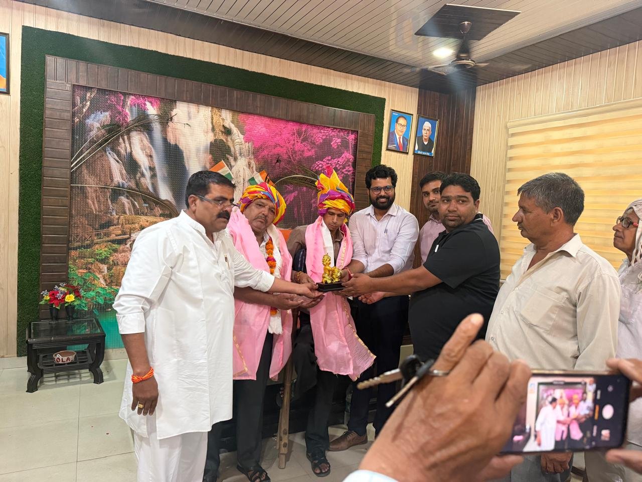 Satish Chahar being honoured by officials and local representatives for successfully completing the first phase of census house listing work in Agra.