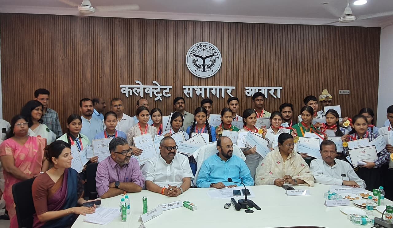 Meritorious students receiving medals, certificates and cash awards during a felicitation ceremony in Agra.