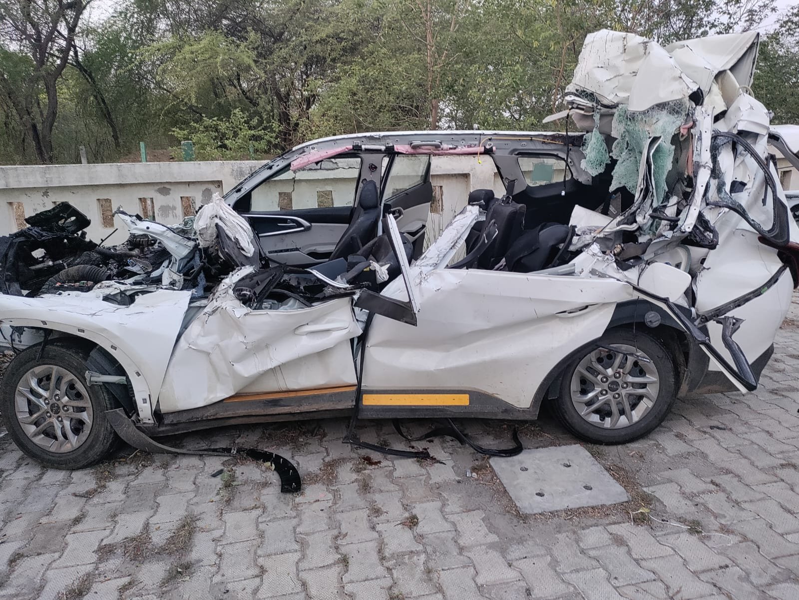 Damaged car after a tragic road accident on Agra-Lucknow Expressway in Fatehabad where three people died and five others were seriously injured when the vehicle collided with a container.