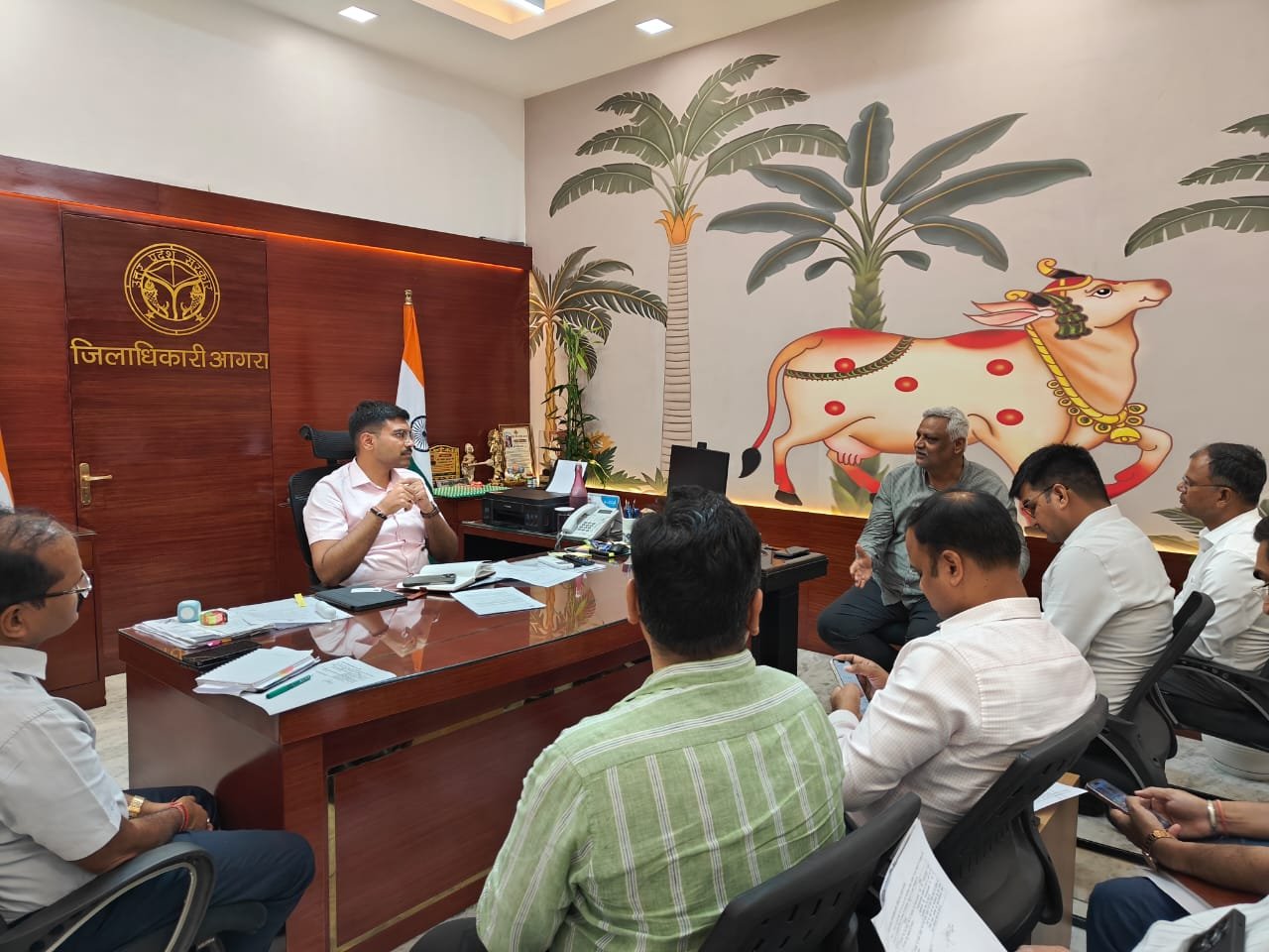District Magistrate Manish Bansal chairing a review meeting with officials to address waterlogging and drainage issues in Etmadpur Assembly constituency.