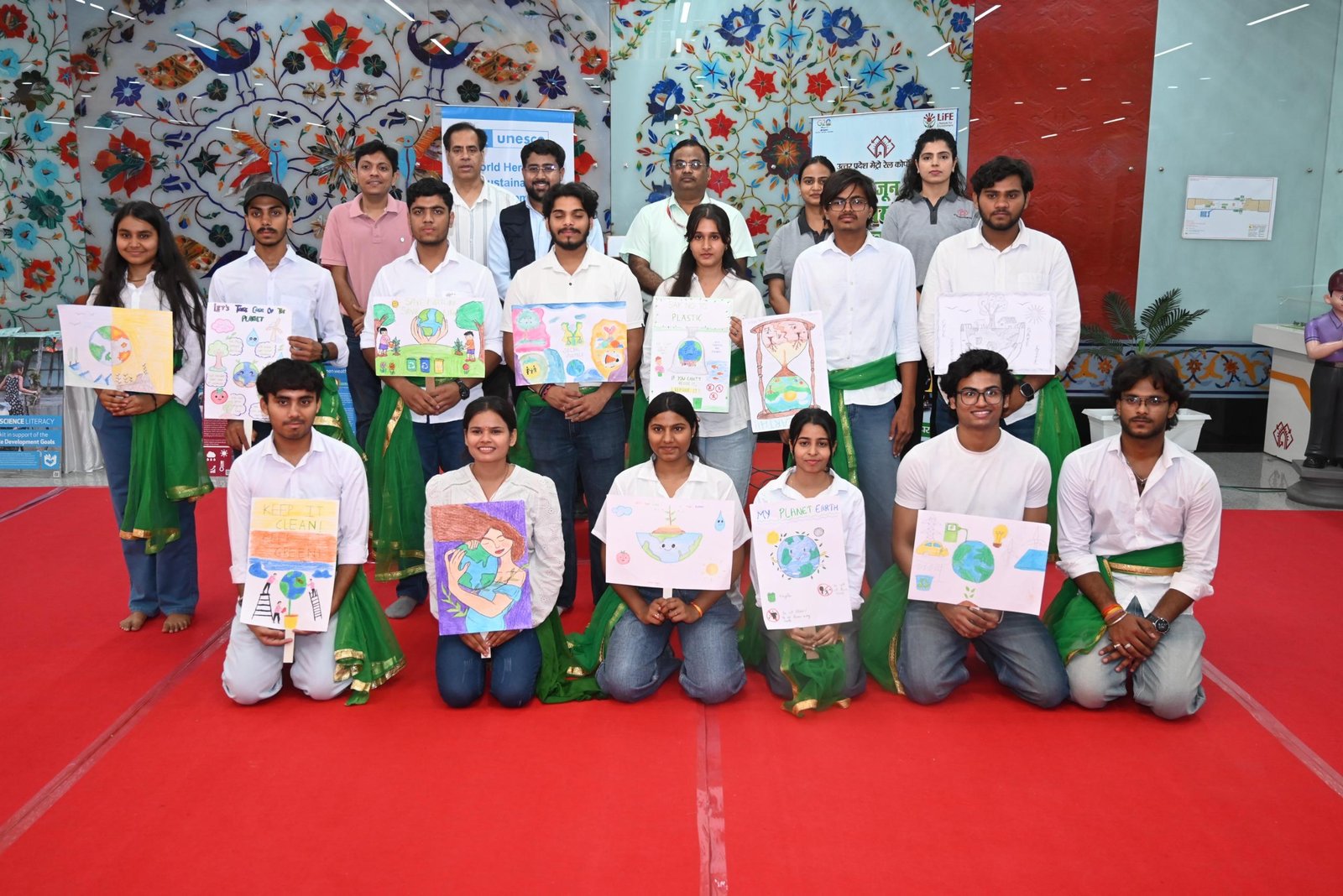 Students and environmental activists participate in World Environment Day awareness program at Taj Mahal Metro Station in Agra.