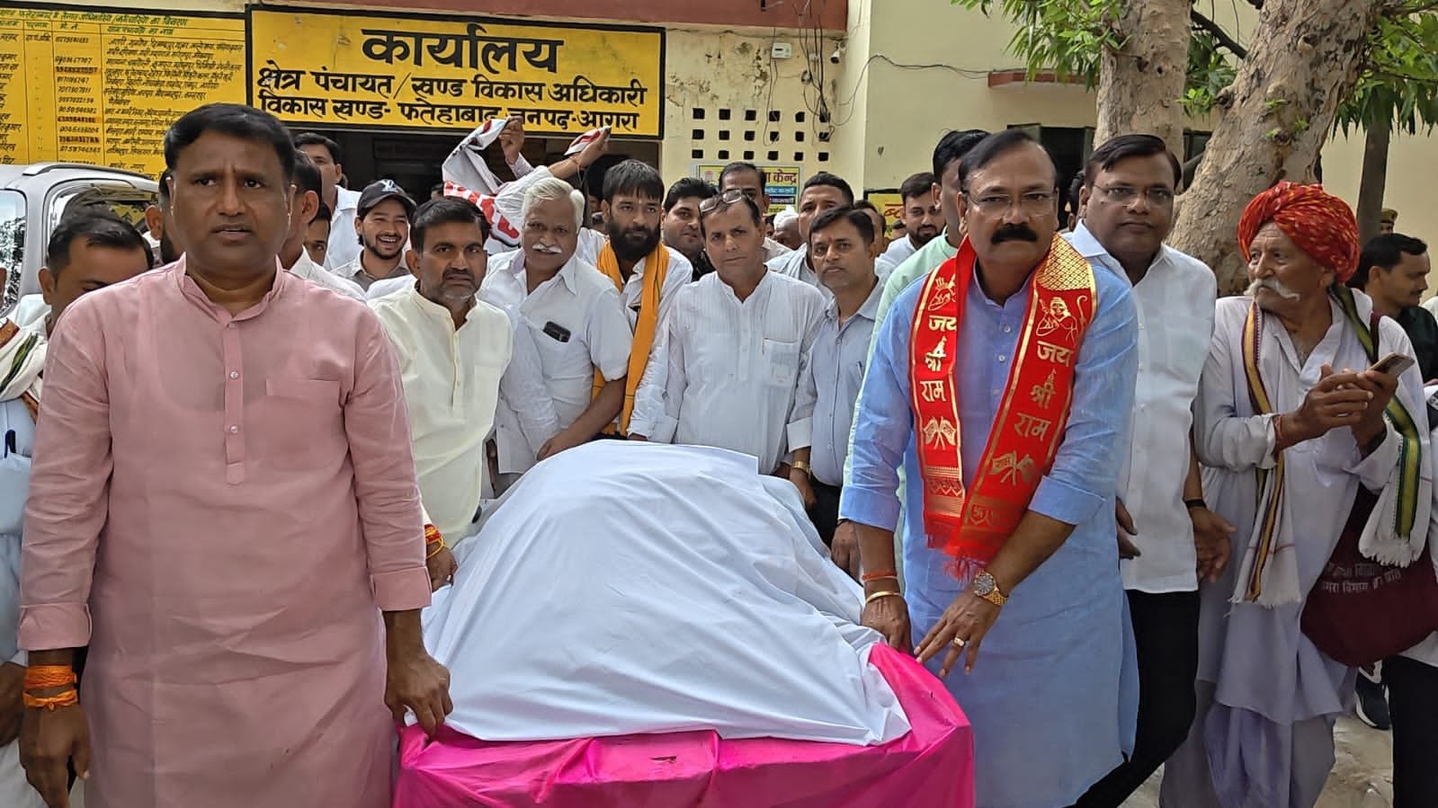 People carrying a symbolic plastic funeral procession during an environmental awareness campaign in Fatehabad.