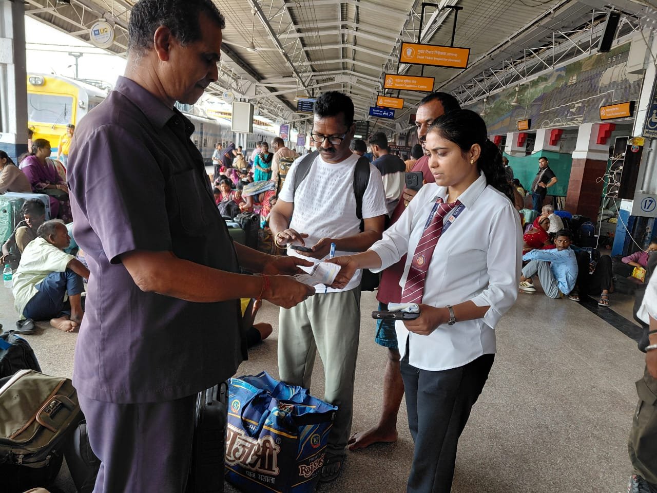 Railway ticket checking staff inspecting passengers during special ticket checking drive in Agra division