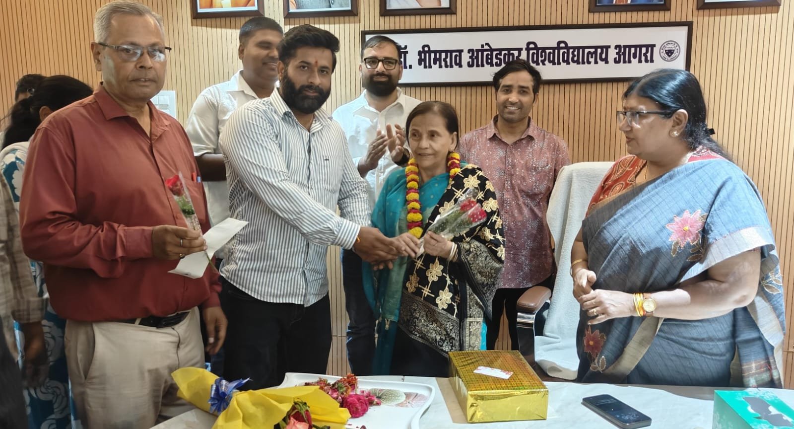 Farewell ceremony of Shamim Bano, assistant cook at Dr. Bhimrao Ambedkar University Agra, attended by Vice Chancellor Prof. Ashu Rani and university staff